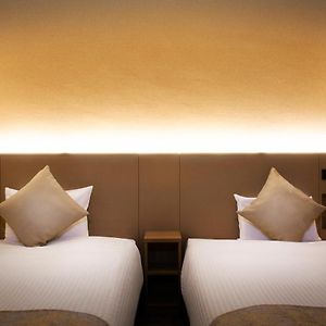 Kamer met Twee Aparte Bedden in een Bijgebouw